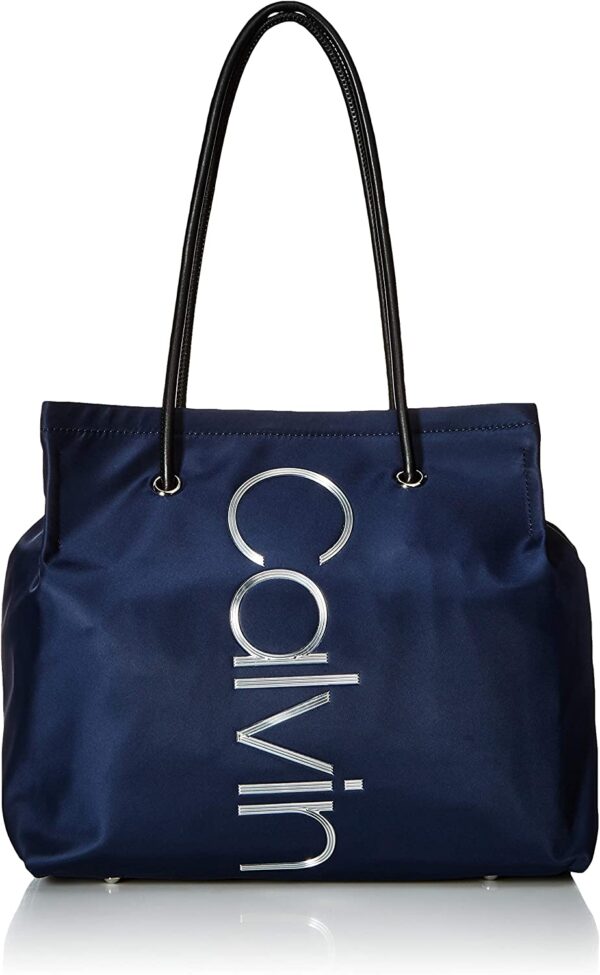 Visit the Calvin Klein Store Calvin Klein Mallory Nylon North/South Vertical Branding Tote 4.2 out of 5 stars    52 ratings | 5 answered questions -37% $93.24 List Price: $148.00  $124.76 Shipping & Import Fees Deposit to Nigeria Details  Size: One Size Color: Navy